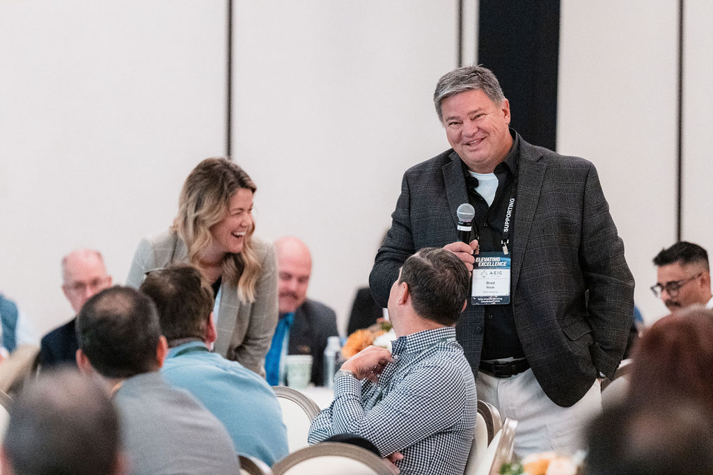 Members sharing a laugh between sessions