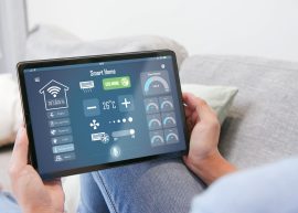 Iot,Smart,Home,Concept,-,Rear,View,Of,Asian,Woman